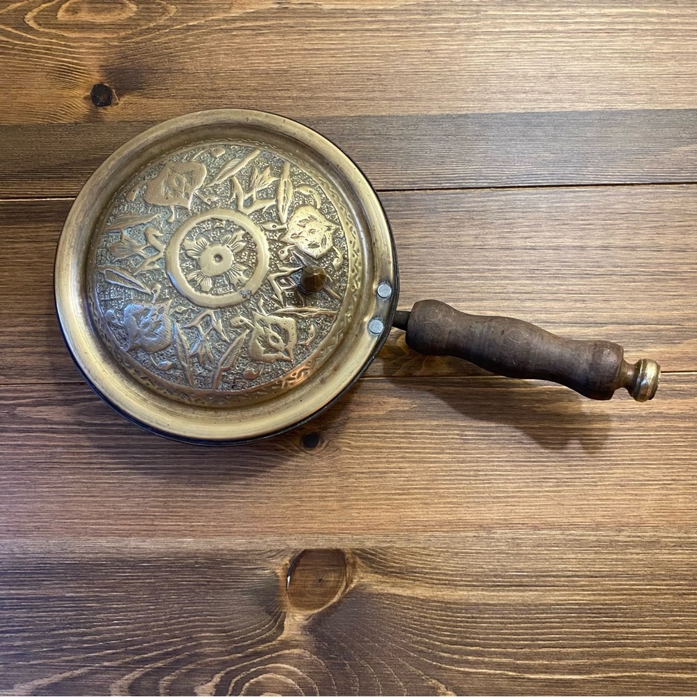 Vintage brass crumb catcher pan with thumb lib and wood handle